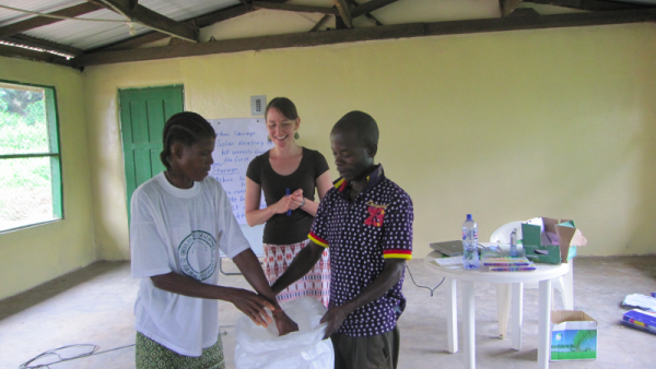 Farmer-to-Farmer volunteer Carrie Teiken shares new techniques with Liberian farmers.